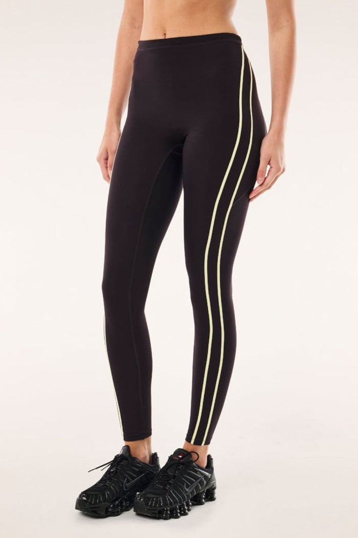 ELSHAM BOUTIQUE black bean high-rise leggings with soft yellow contrast flatlock side stripes and functional drawcord.