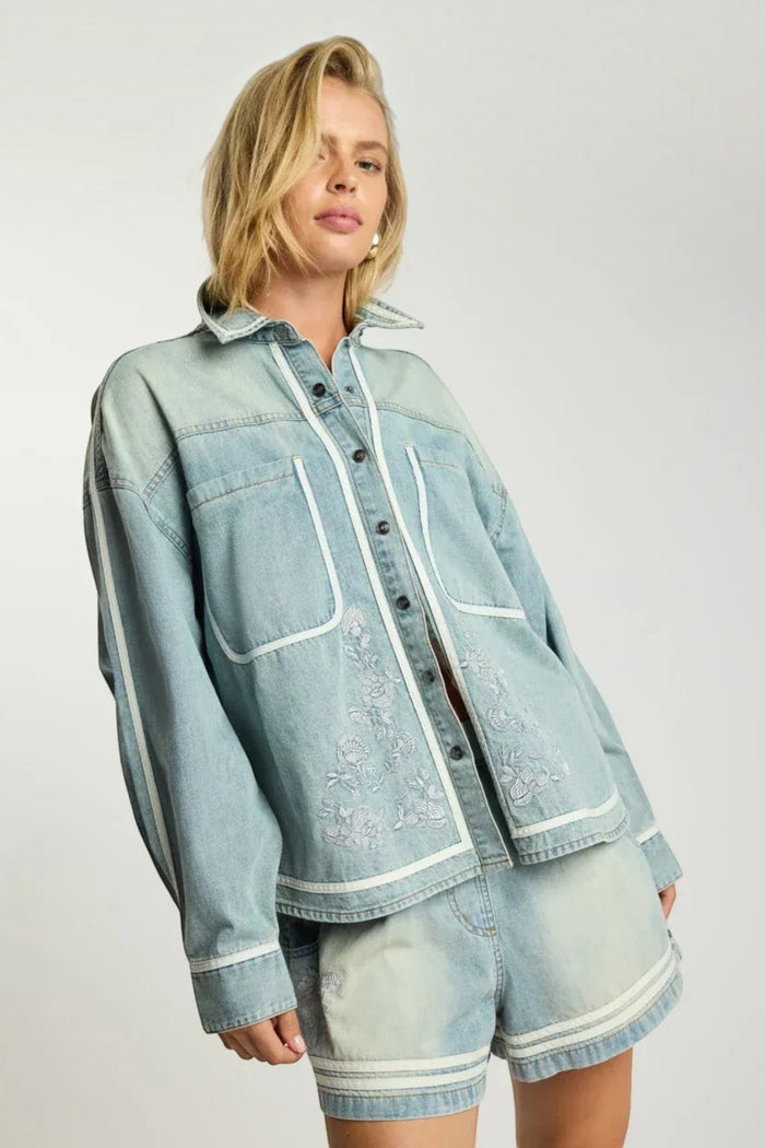ELSHAM BOUTIQUE chambray blue denim shirt with white trim and delicate floral embroidery in a relaxed fit