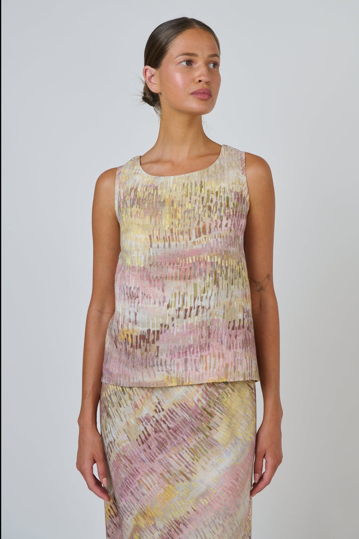 ELSHAM BOUTIQUE sleeveless linen top in a multi-coloured abstract print with a round neck and high-low hemline.