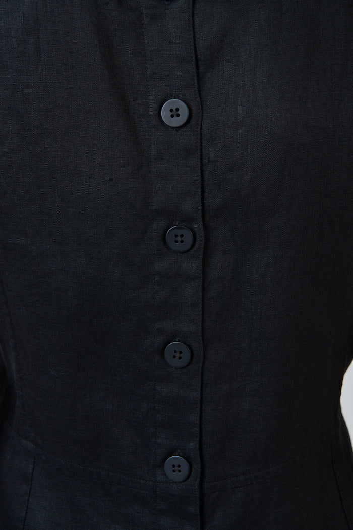 Close-up of the black linen fabric and tonal button placket on the back of an ELSHAM BOUTIQUE GA735 midi dress.