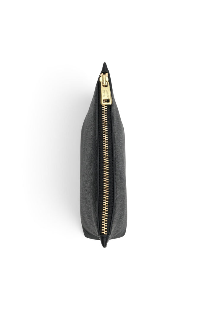ELSHAM BOUTIQUE black calf nappa leather mini poucher with gold brass zip closure, top-down view.
