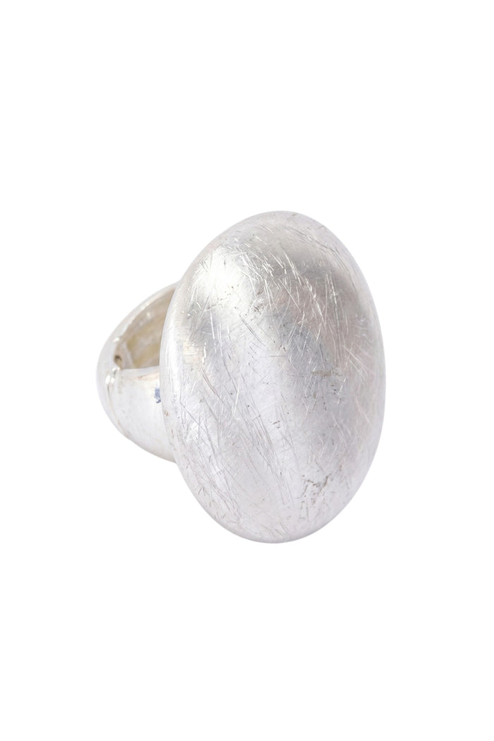 ELSHAM BOUTIQUE Nola ring in silver with a smooth domed face and brushed texture finish. Modern sculptural design.