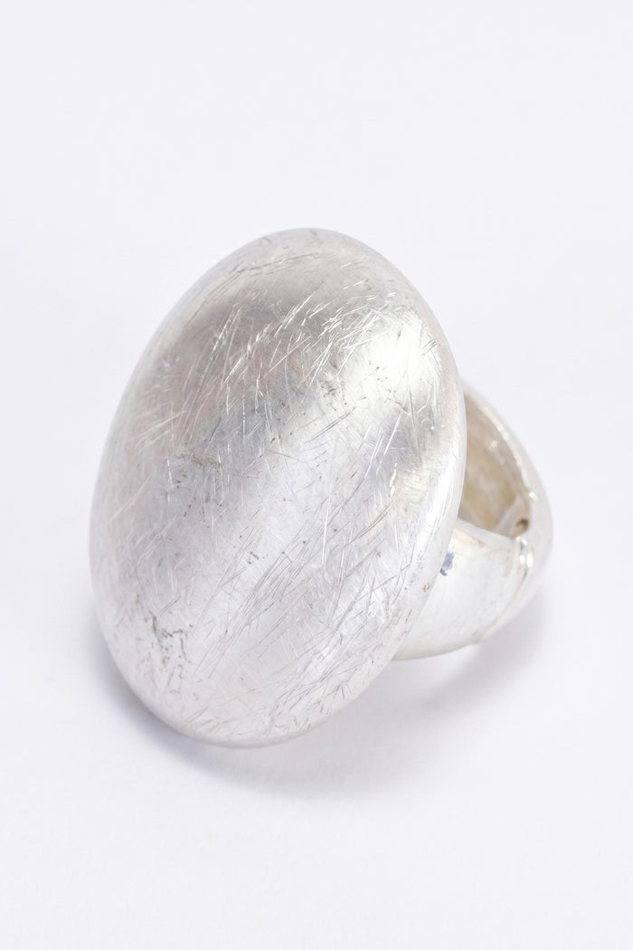 ELSHAM BOUTIQUE Nola ring in silver with a smooth domed face and brushed texture finish. Modern sculptural design.