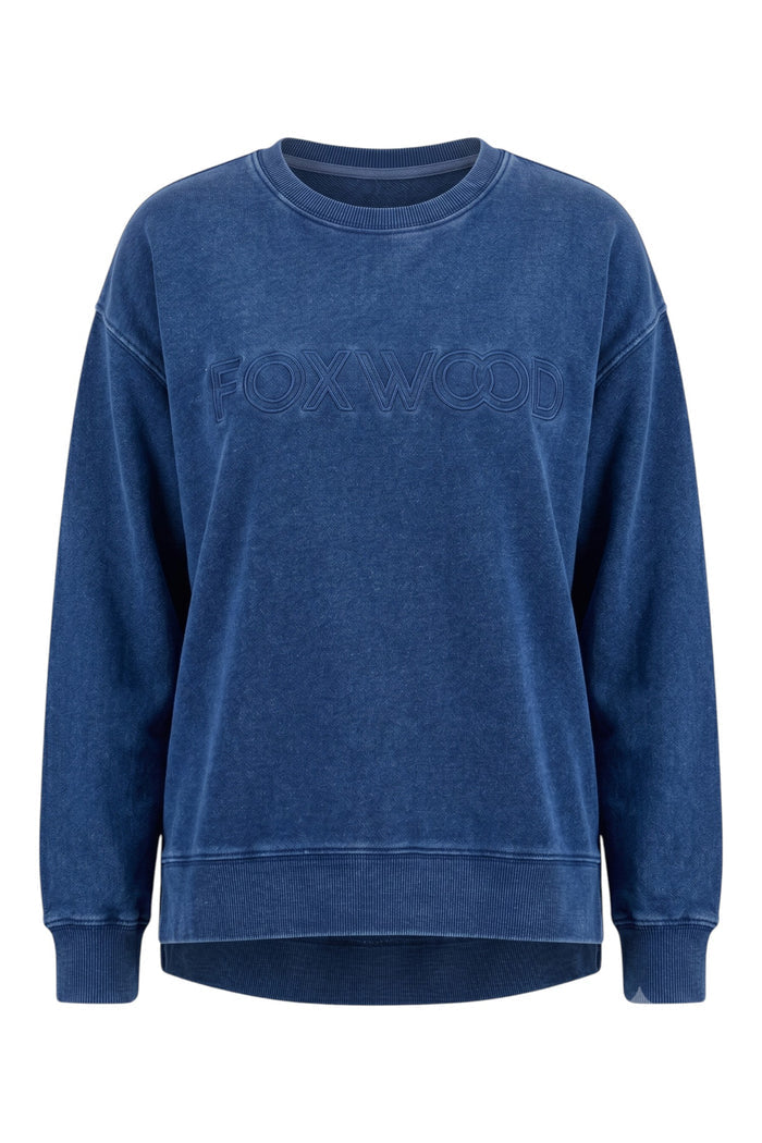 ELSHAM BOUTIQUE Remedy oversized indigo cotton crew neck sweatshirt with tonal Foxwood chest logo and side splits.