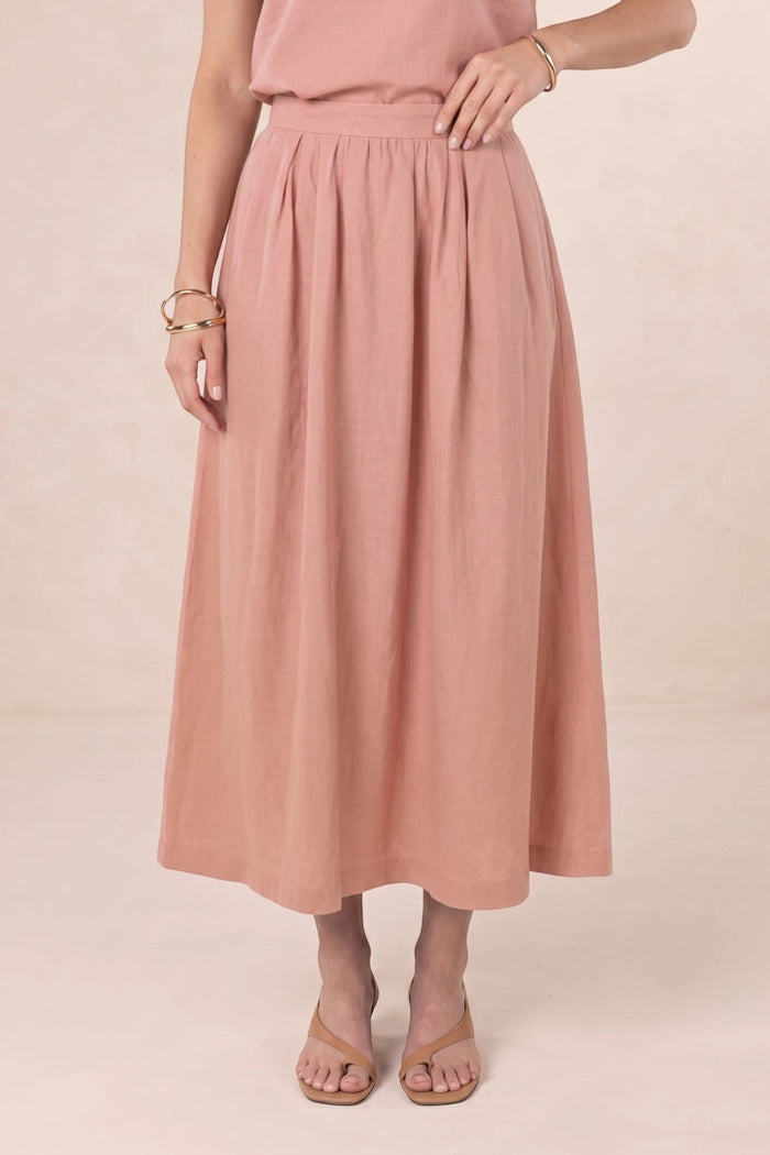 ELSHAM BOUTIQUE Solar Skirt in musk pink linen-tencel blend, featuring an A-line midi silhouette and side pockets.