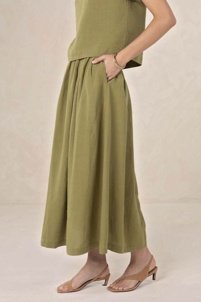 ELSHAM BOUTIQUE olive midi skirt in a linen-tencel blend with an A-line silhouette and functional side pockets