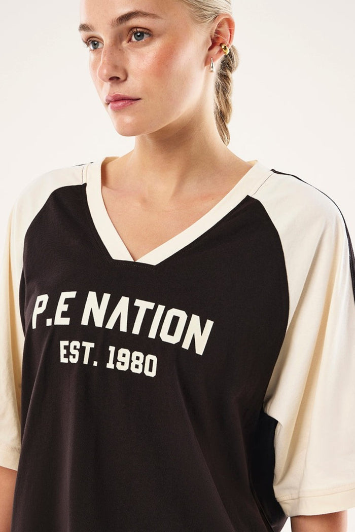 ELSHAM BOUTIQUE Spinout baseball tee in black and whisper white organic cotton with graphic print and contrast binding