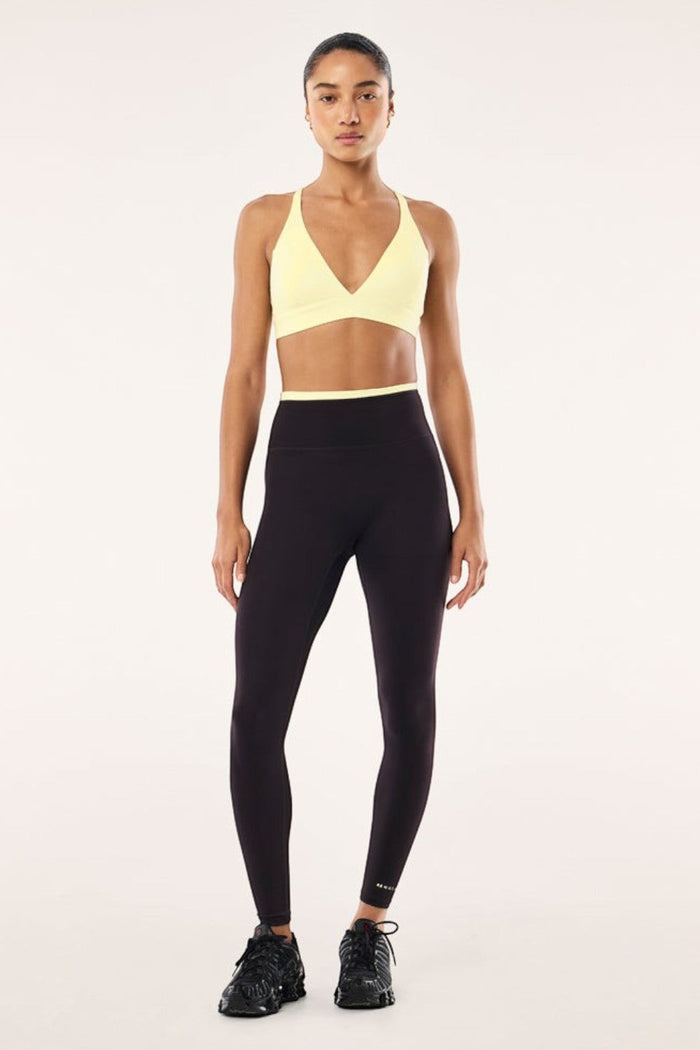 ELSHAM BOUTIQUE Vita full length leggings in black bean with soft yellow waistband detail worn by a model